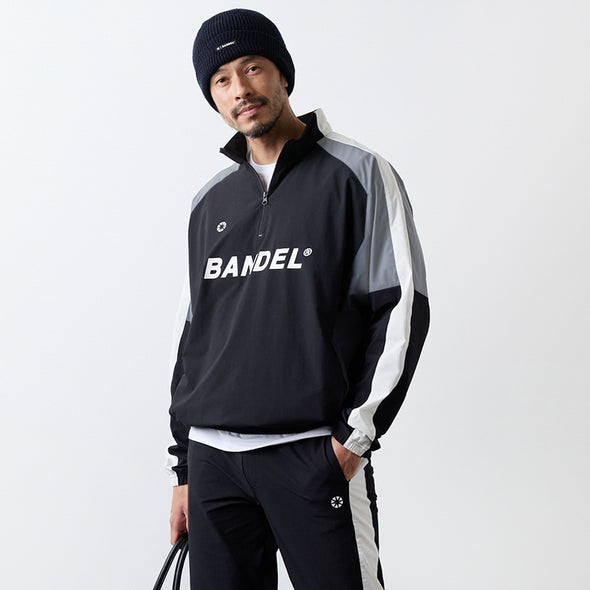 ユーティリティ ハーフジップジャケット